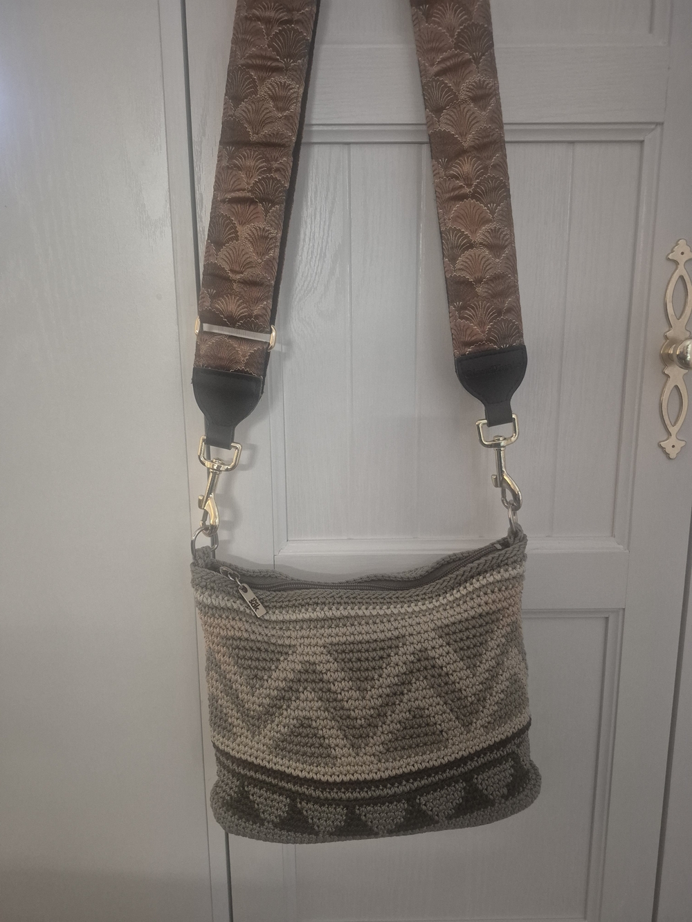 The Sak Beige and Olive Crochet Crossbody Pouch With Decorative Guitar Strap